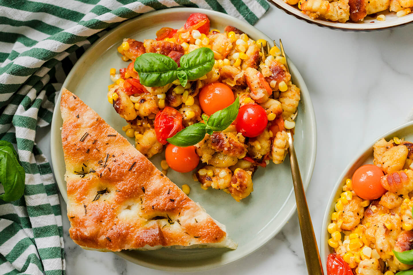 plate of crispy corn gnocchi served with focaccia 