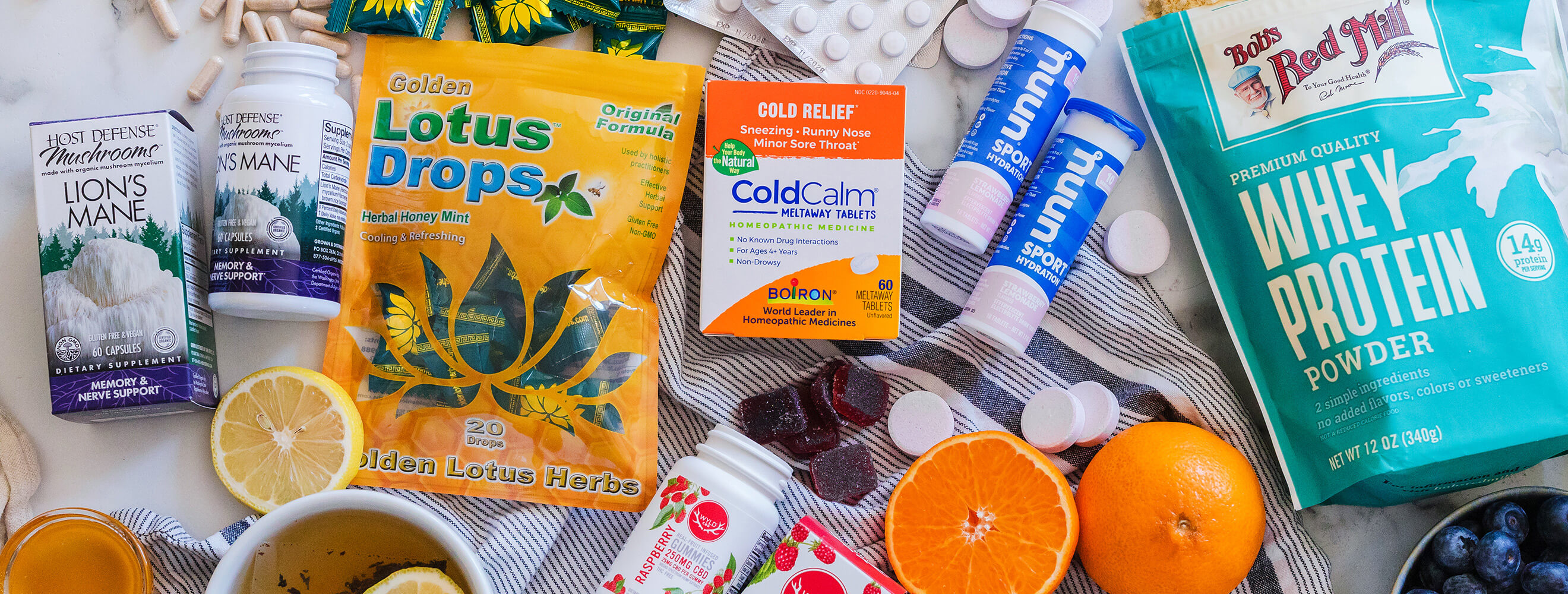 a variety of packaged vitamins and supplements displayed on a counter