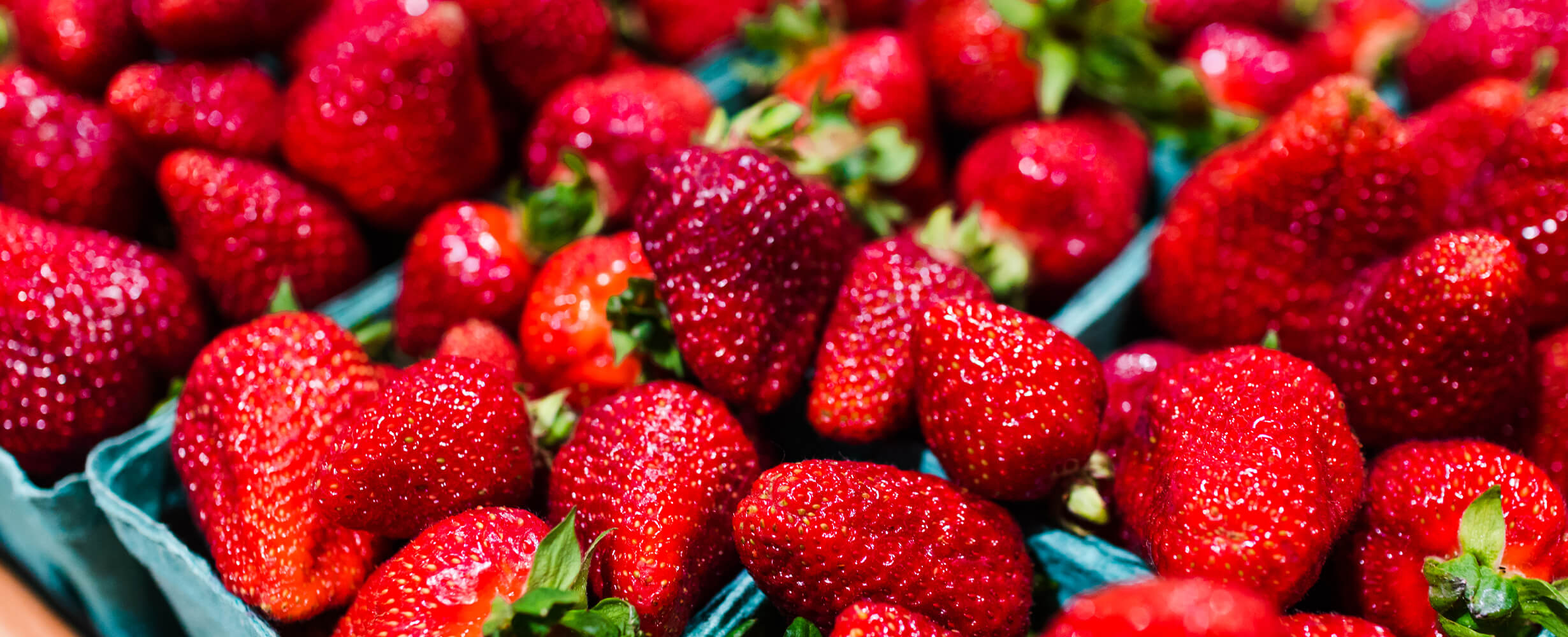 An image of local strawberries in pints