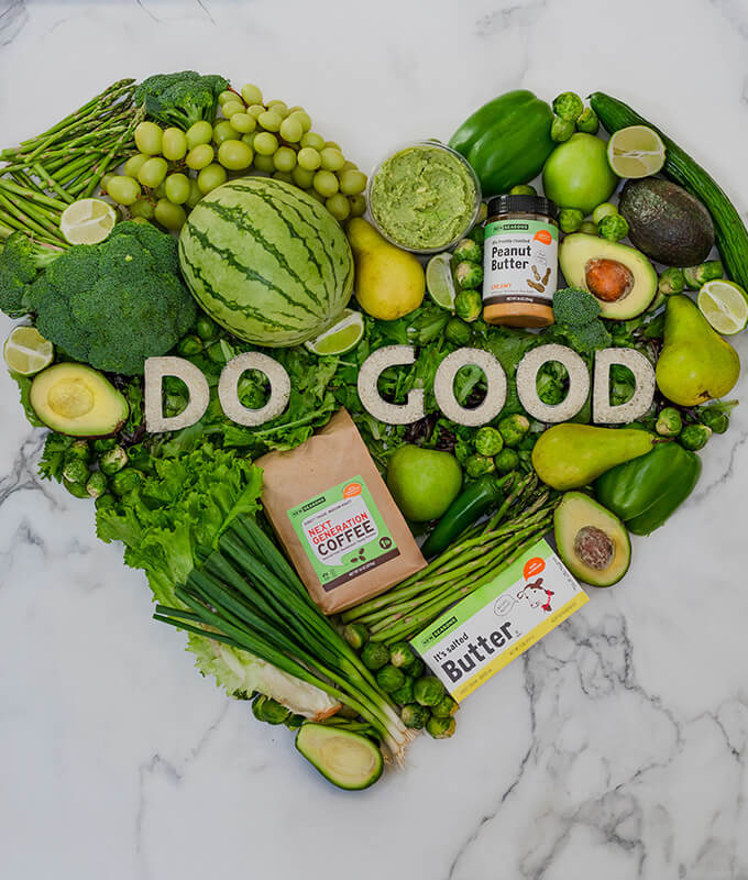 green fruits, vegetables and grocery items arranged in a heart shape with the words "do good" in the center.