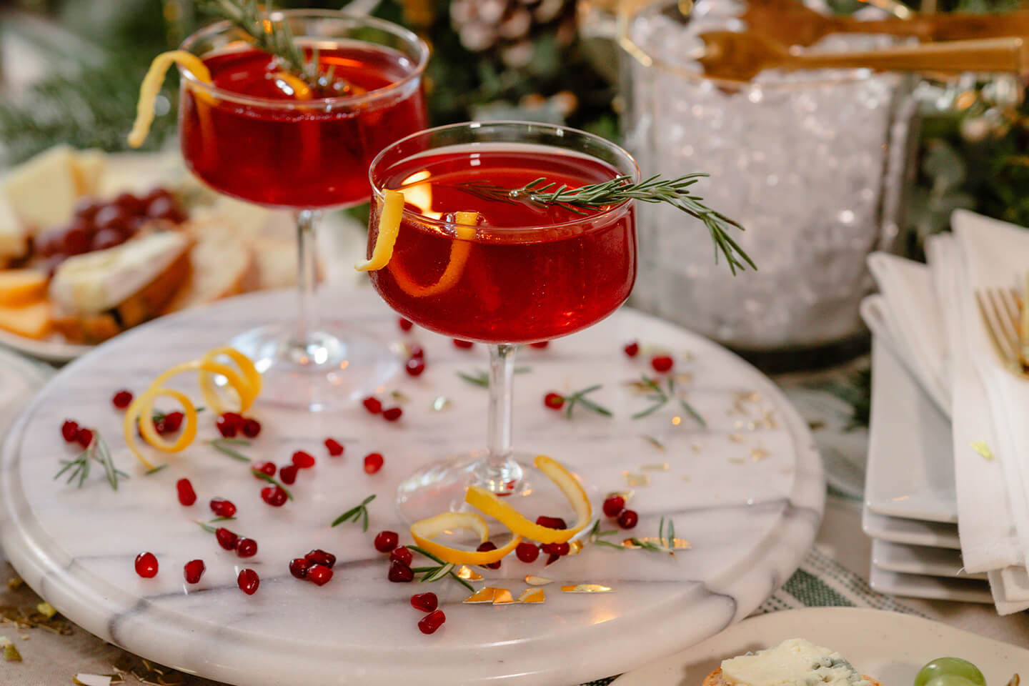 Two holiday pomegranate French 75 cocktails.