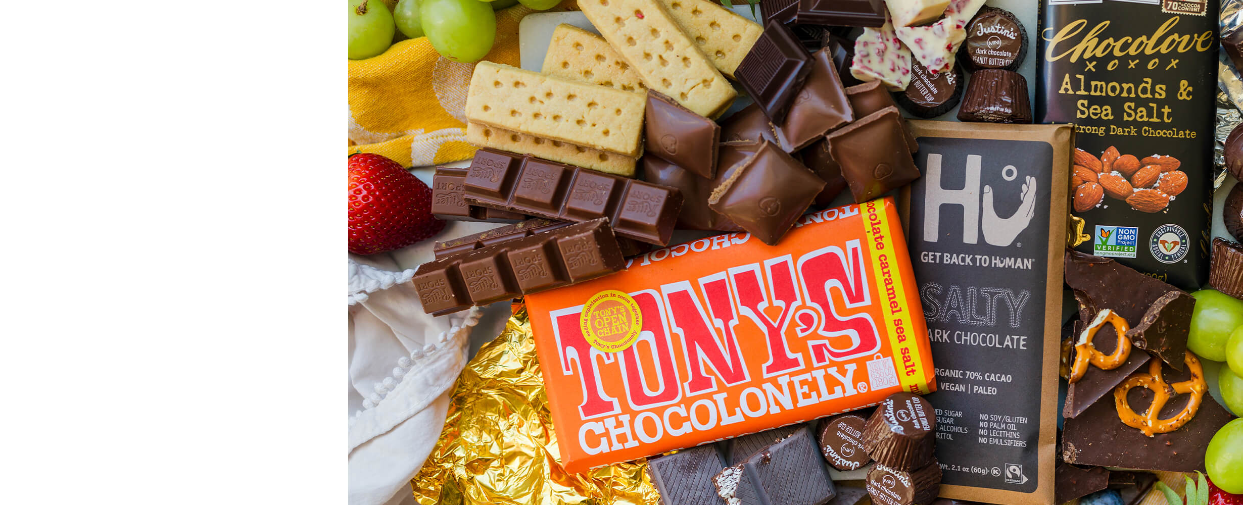 Top down image of an assortment of cholates including Tony's Chocolonely, Chocolove Almonds & Sea Salt and Get Back To Human Salty Dark Chocolate.