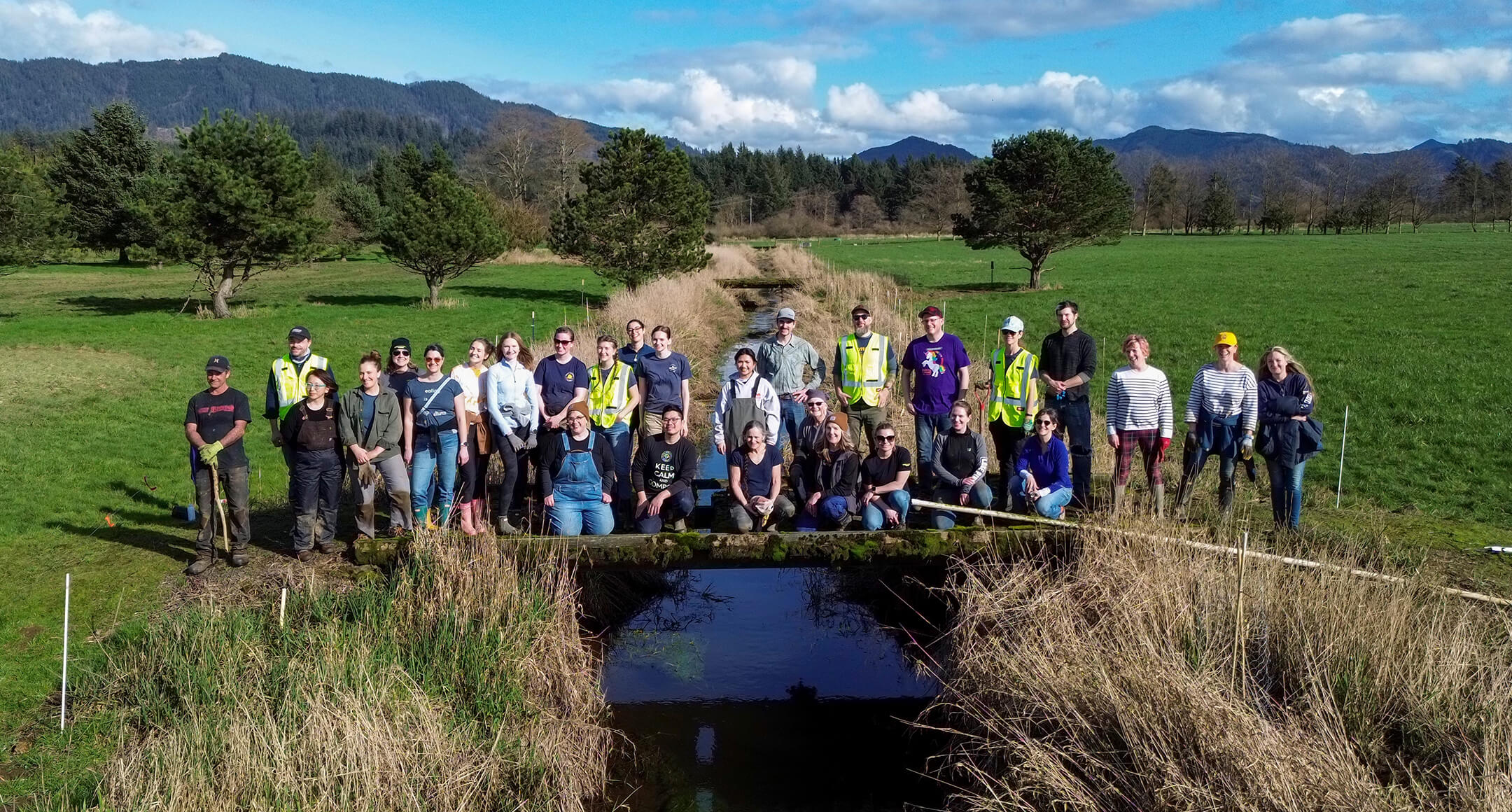 New Seasons and Tillamook staff volunteers posing for a group photo at the planting event.