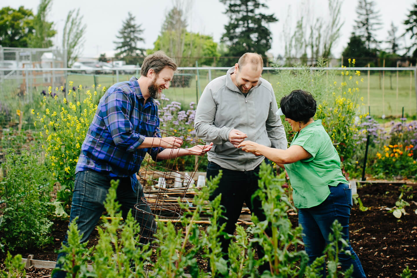 Growing Gardens members standing in a garden.